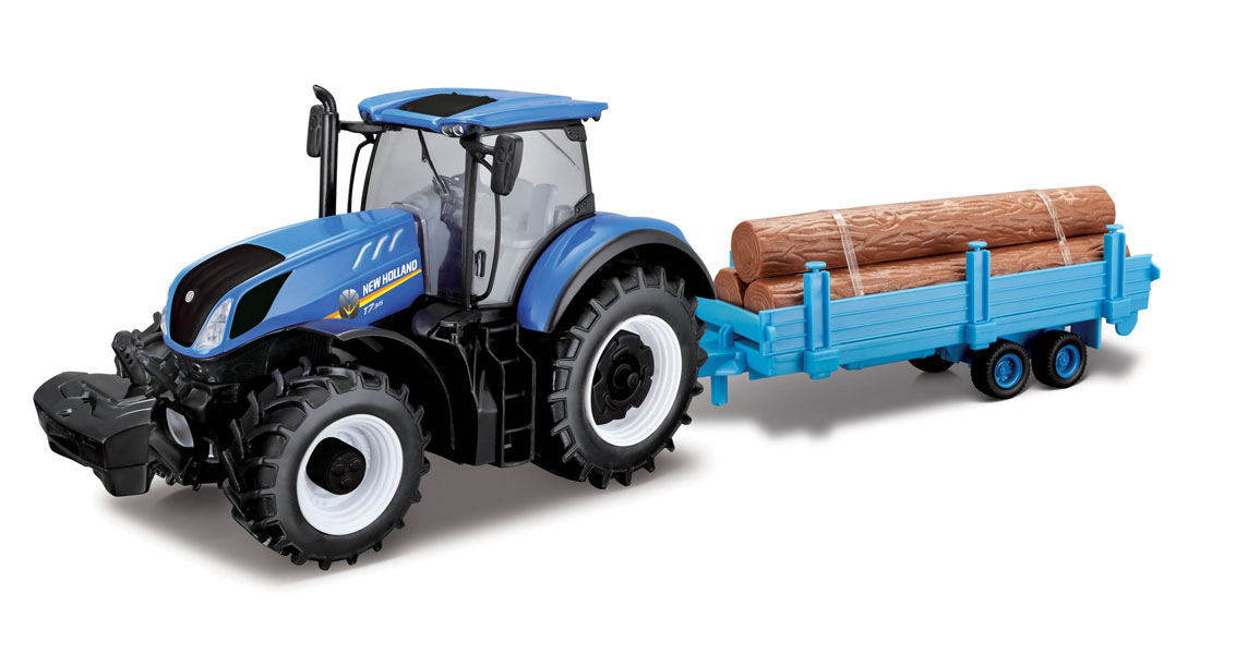 New Holland - Traktor med timmerstockar
